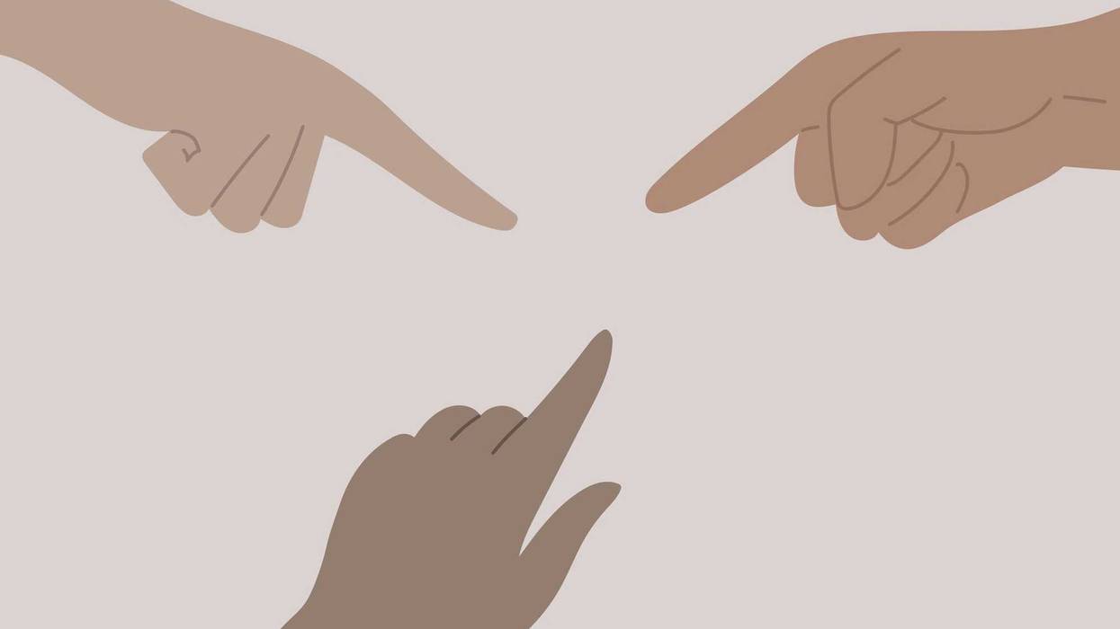 People pointing at one another.