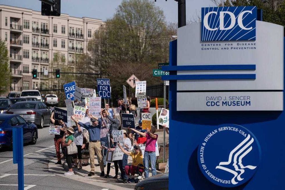 People protest in support of the Centers for Disease Control and Prevention in front of the headquarters in Atlanta, Tuesday, April 1, 2025 after layoffs were announced.