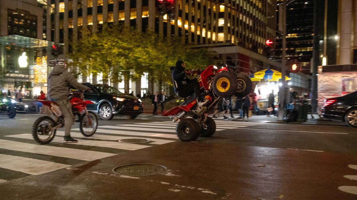 People ride dirt bikes and ATVs down Fifth Avenue in New York City