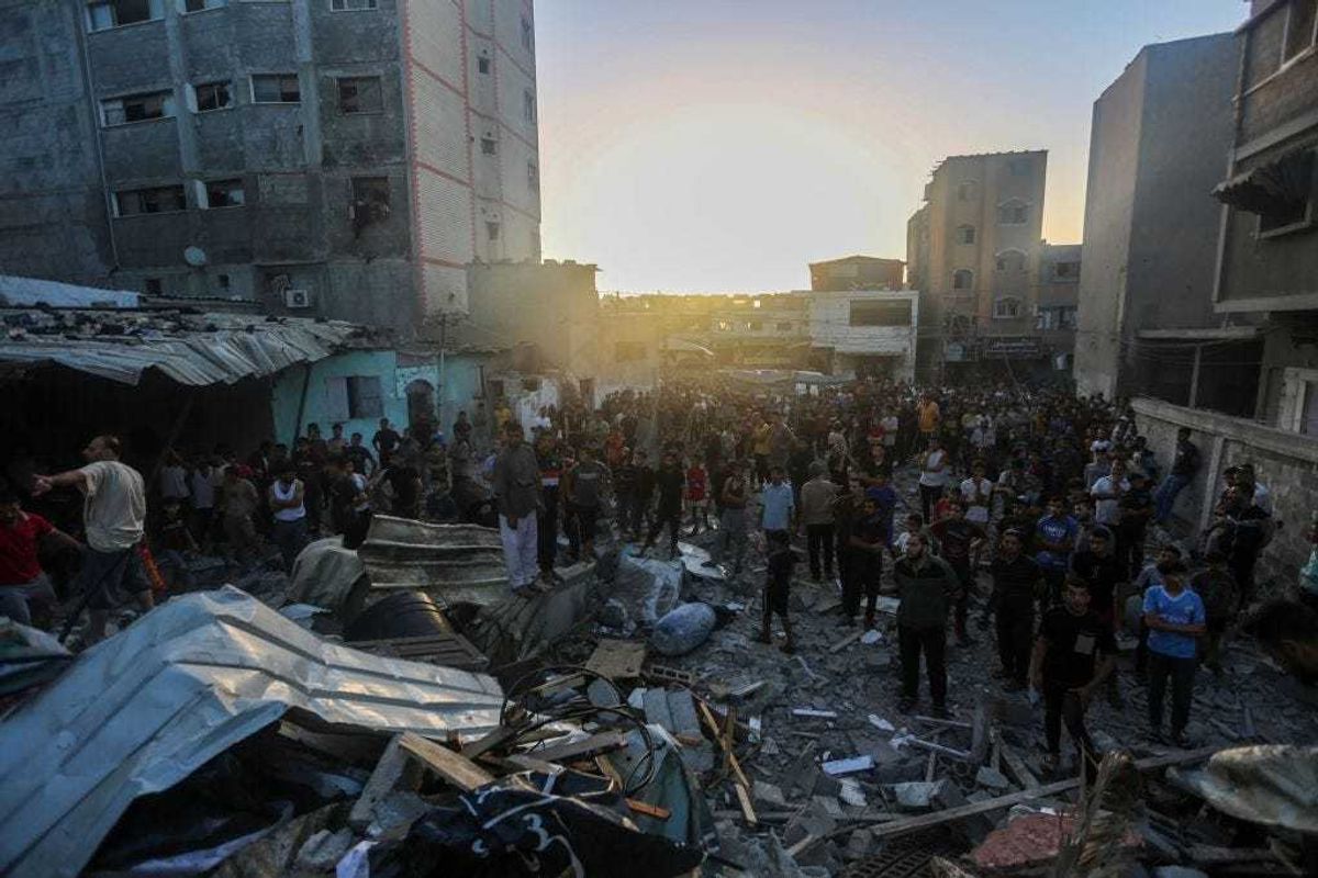 People search through buildings that were destroyed during Israeli air raids in the southern Gaza Strip November 4 2023 in Khan Yunis, Gaza. The Israeli army has expanded its military assault. The Gaza strip, a besieged Palestinian territory, is under heavy bombing from Israel in response to the large-scale attack carried out on October 7 by Hamas in Israel. The international community is stepping up pressure for a humanitarian truce.(Photo by Ahmad Hasaballah/Getty Images)