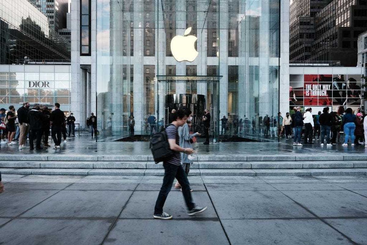 People shop at the Fifth Avenue Apple Store during the launch of Apple’s new iPhone 13 and iPhone 13 Mini on September 24, 2021 in New York City.