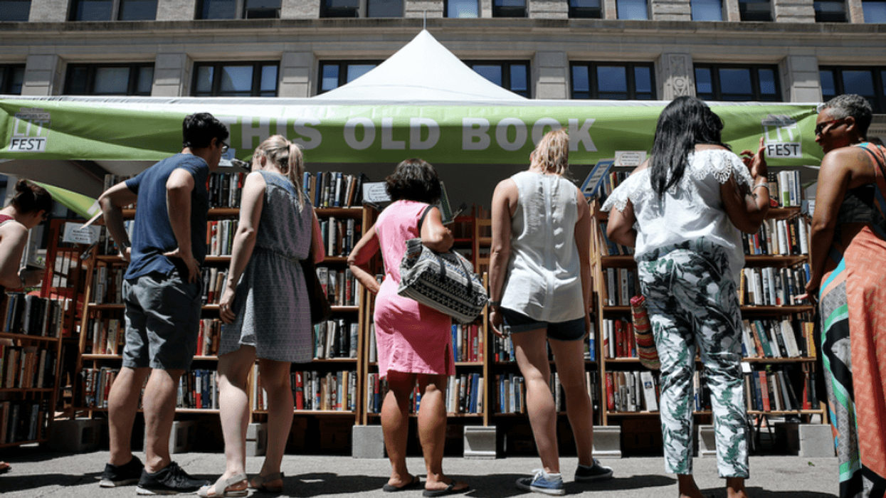 People shop for books at the Printers Row Lit Fest Saturday, June 10, 2017, in Chicago, Ill.