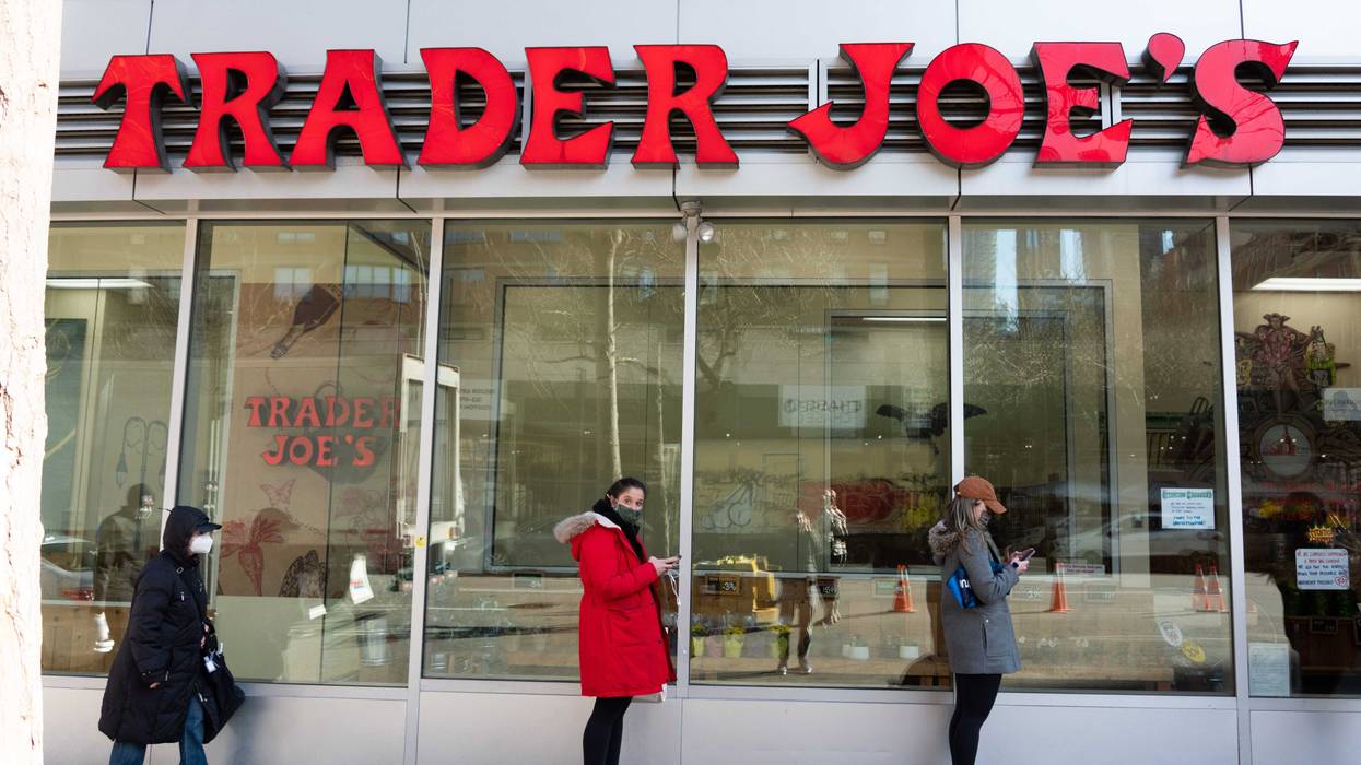 People stand in line outside Trader Joe's in Kips Bay amid the coronavirus pandemic on March 19, 2021 in New York City.