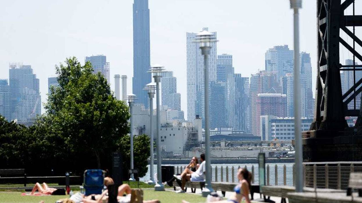 People sunbathe during a hot weather week in New York City on June 21, 2024.