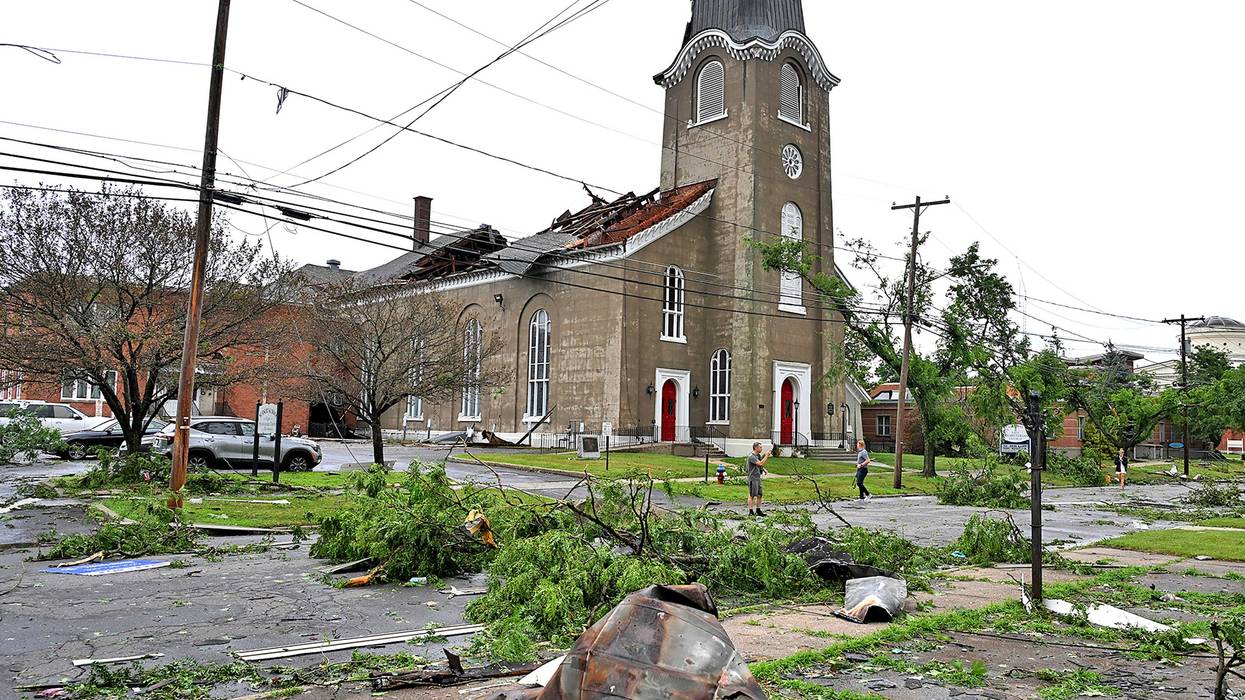 People survey the collapsed roof and missing spire of the Rome First Presbyterian Church, and downed trees from a tornado, in Rome, N.Y., Tuesday, July 16, 2024