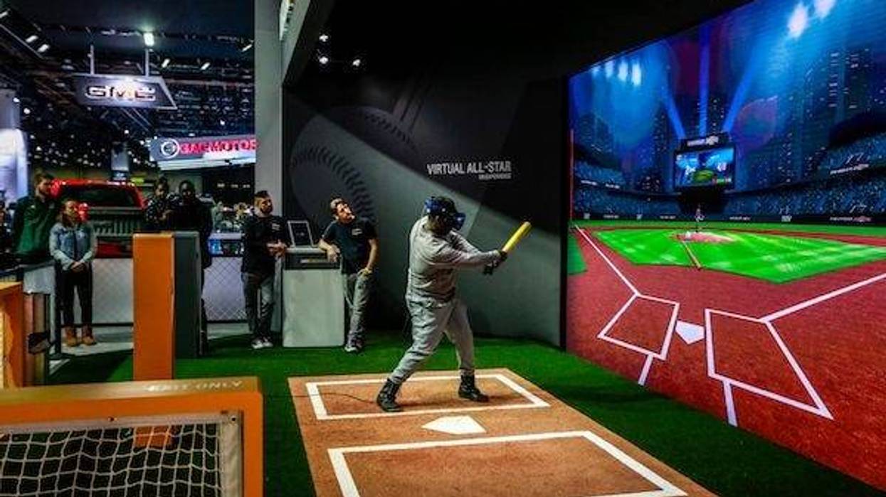 People swing away in a baseball simulation called the Virtual All-Star VR Experience
