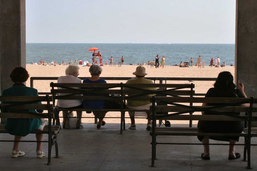 People take in a summer day at Brighton Beach