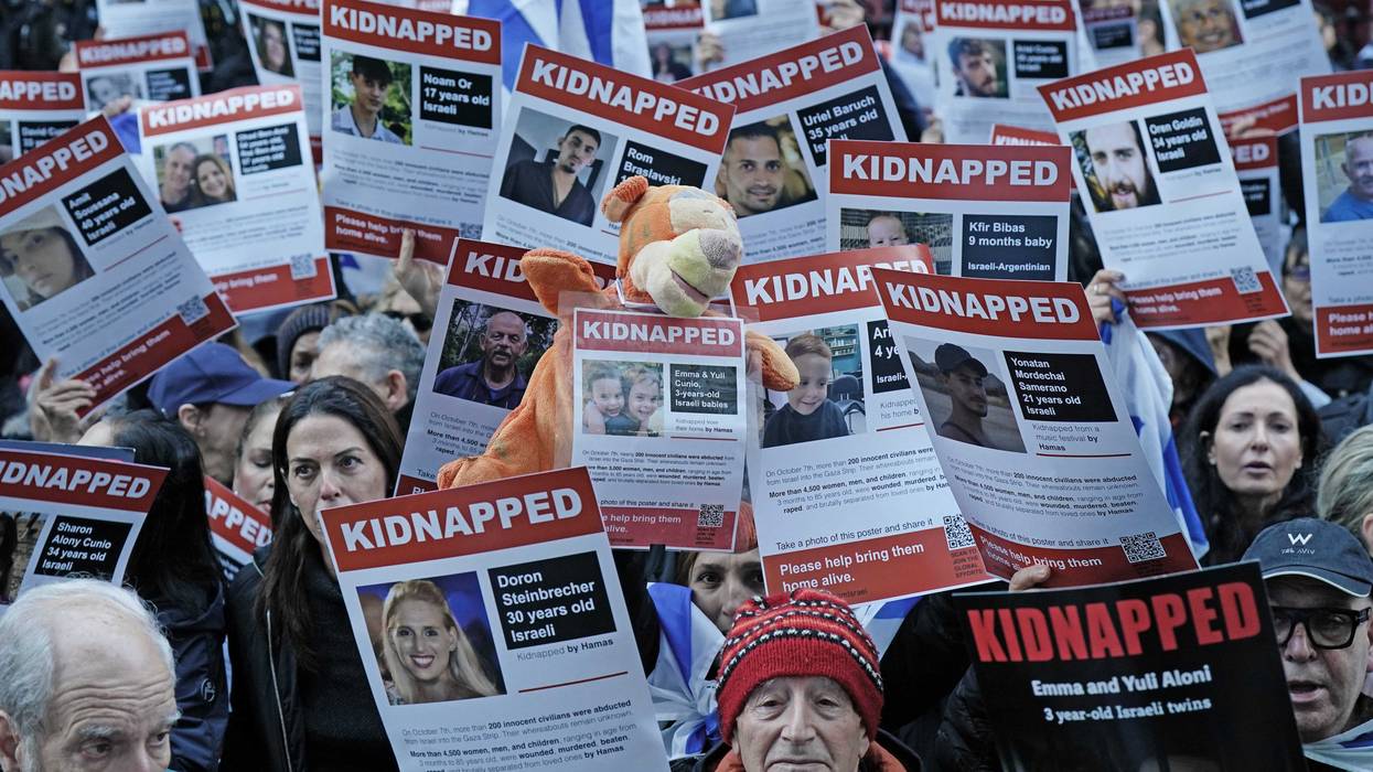 People take part in a peaceful gathering of unity and solidarity in front of the Embassy of Qatar in London, calling for the release of hostages kidnapped from Israel. Picture date: Sunday October 29, 2023. (Photo by Aaron Chown/PA Images via Getty Images)