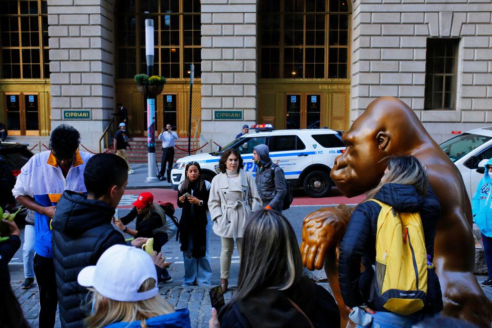 People take photos with the statue of Harambe on October 18, 2021 in New York City