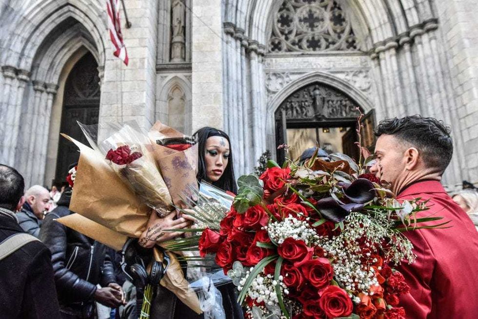 People take roses away from the funeral of transgender community activist Cecilia Gentili at St. Patrick