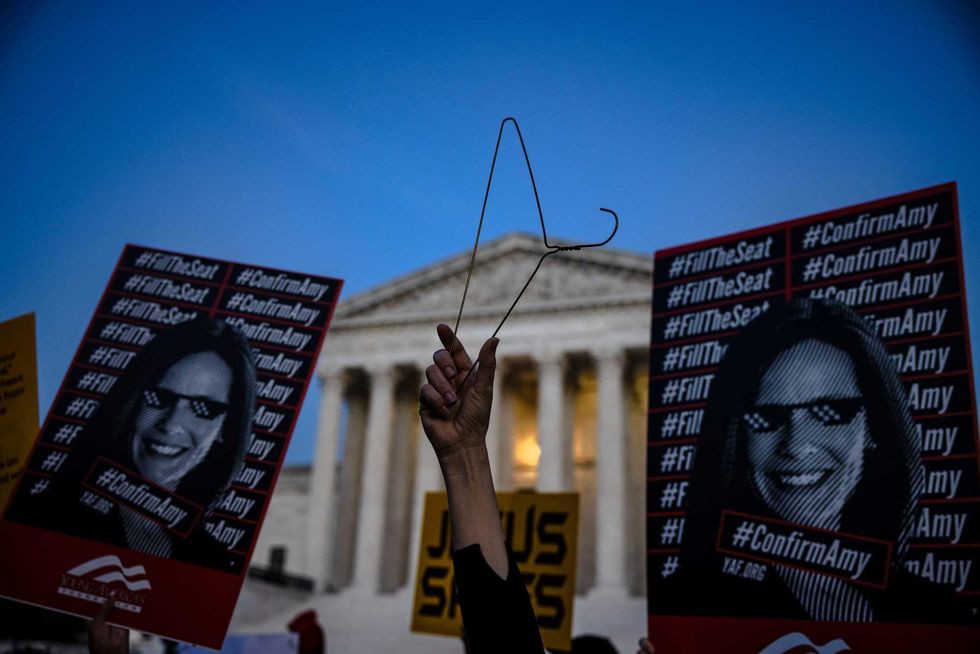 People that both support and oppose the nomination of Judge Amy Coney Barrett demonstrate in front of the Supreme Court of the United States on October 26, 2020 in Washington, DC. It is expected that the Senate will vote on the nomination of Judge Amy Coney Barrett to be an Associate Justice of the Supreme Court later in the day.
