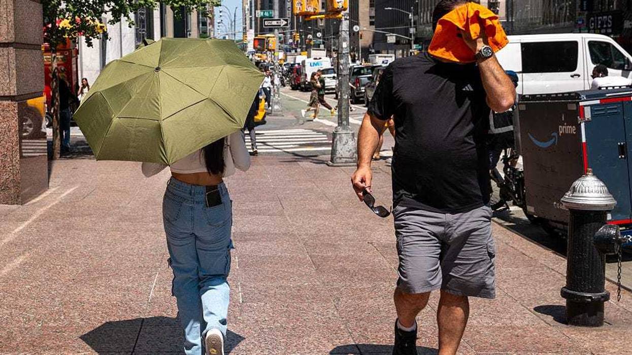 People try to stay cool on the sweltering streets of Manhattan as the region experiences another heatwave on July 29, 2025 in New York City