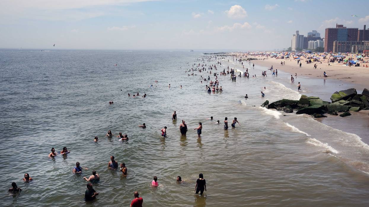 People visit the beach at Coney Island in Brooklyn