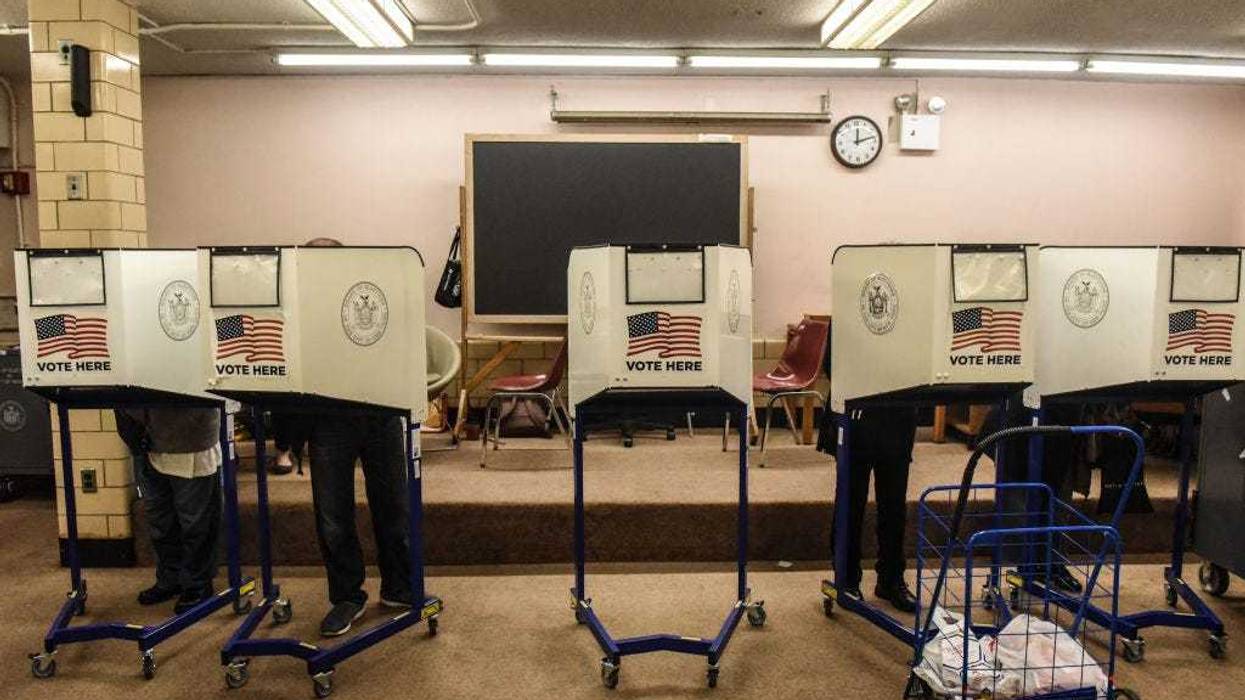 People vote at the Queens Public Library during early voting for the U.S. Presidential election on October 24, 2020 in the Jackson Heights neighborhood in the Queens borough in New York City.