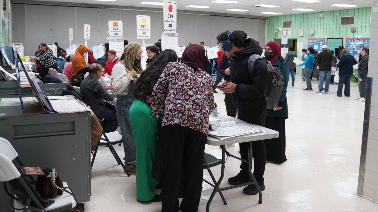 People vote inside a polling station in Queens on Nov. 4, 2025
