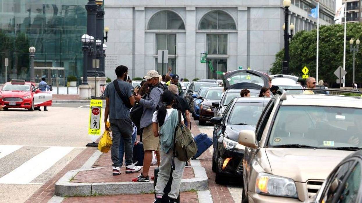 People wait for rideshare cars at Union Station on July 02, 2021 in Washington, DC.