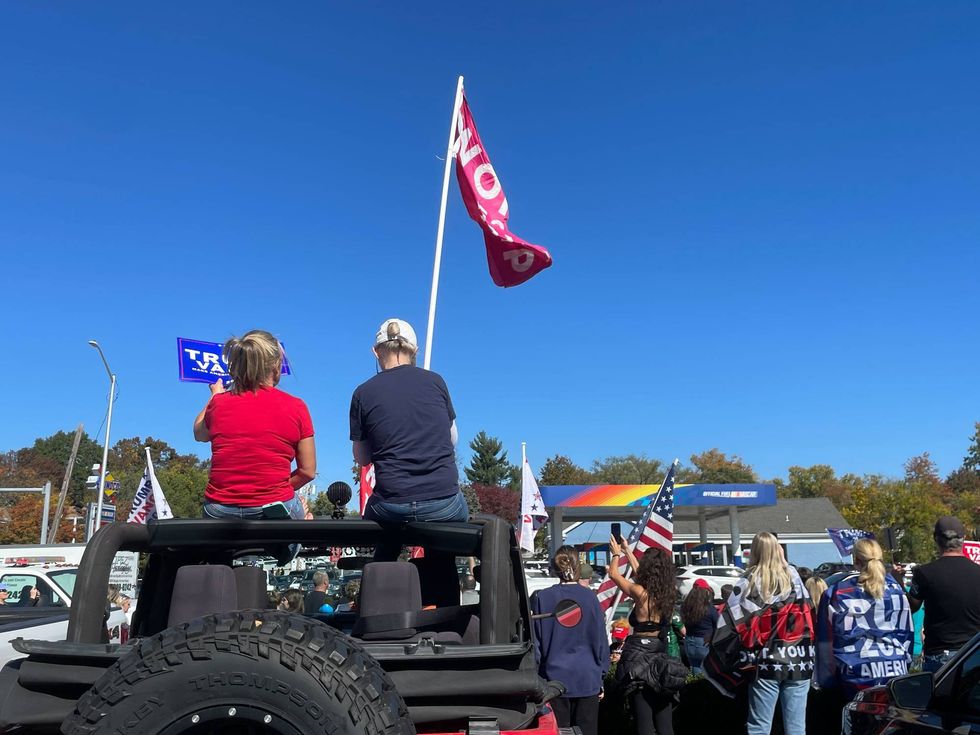 People wait for Trump at McDonald