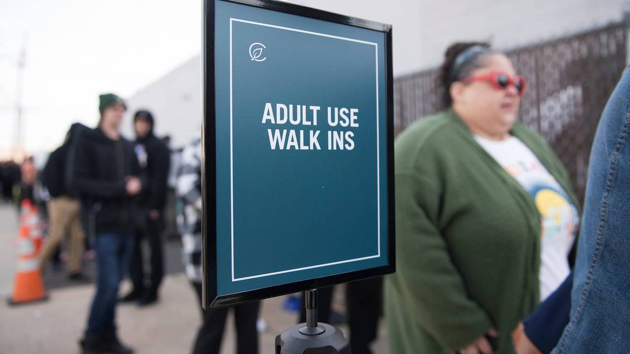 People wait in line outside of the Curaleaf dispensary in Bellmawr as the first sales of recreational marijuana sales in New Jersey took place on April 21, 2022.