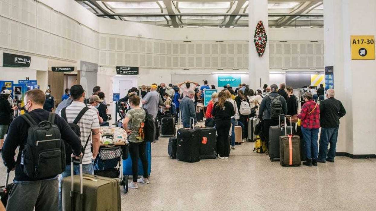 People wait in line to check in at the George Bush Intercontinental Airport on January 06, 2022 in Houston, Texas.