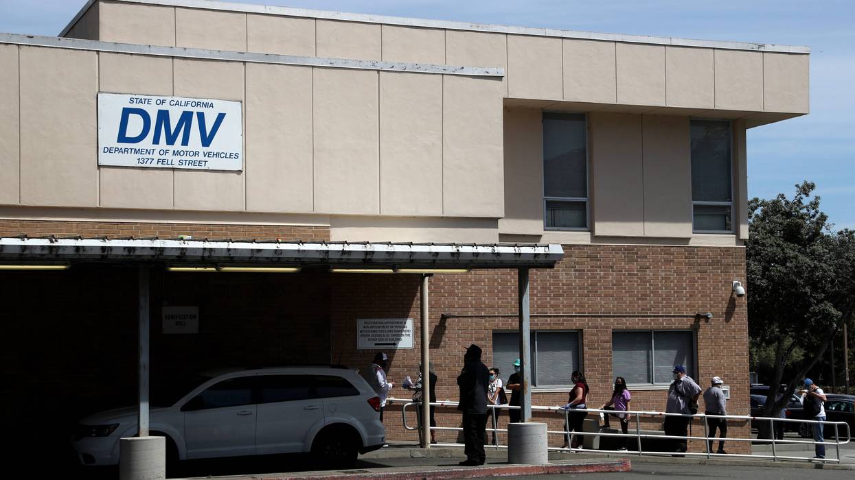 People wait in line to enter a California Department of Motor Vehicles (DMV) office on May 08, 2020 in San Francisco, California.