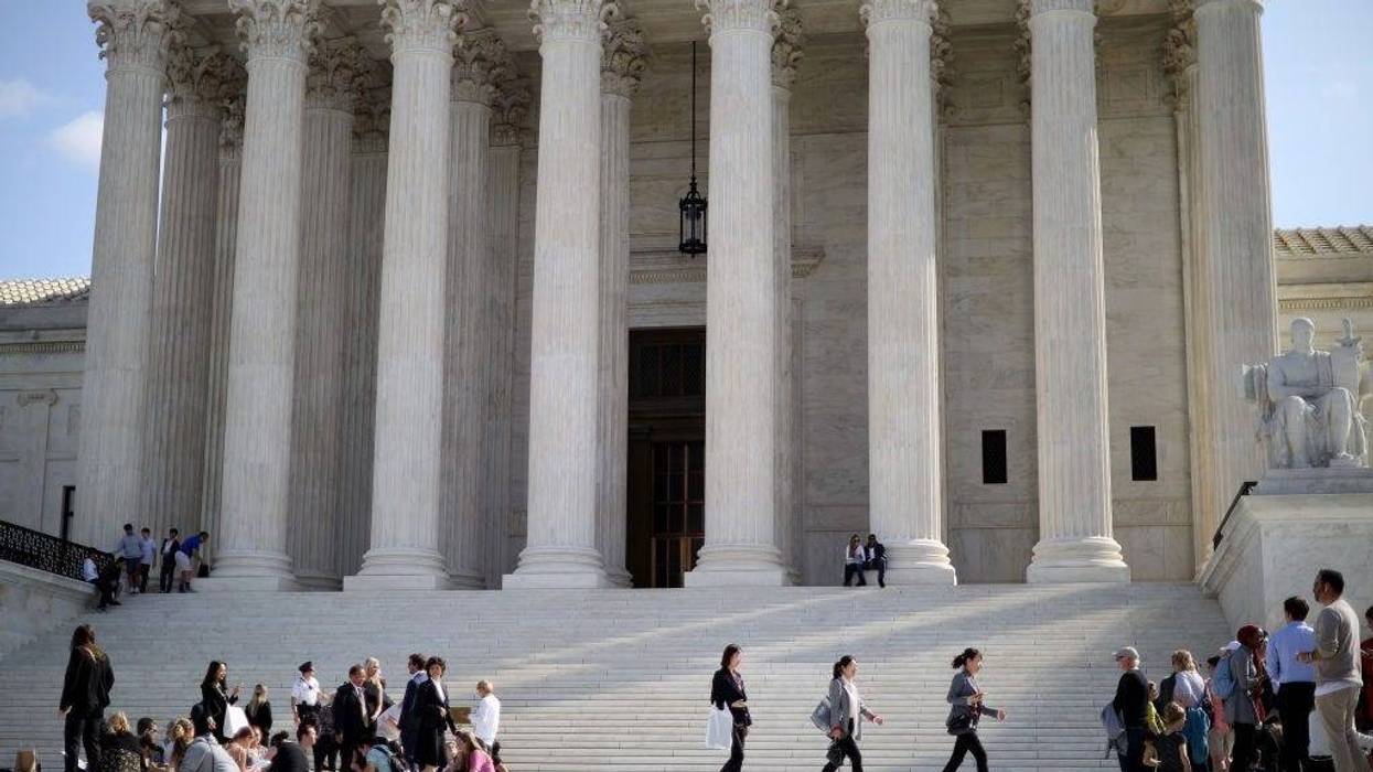 People wait in line with hundreds of others for the chance to attend arguments outside the U.S. Supreme Court building at the start of the court's new term October 07, 2019 in Washington, DC.