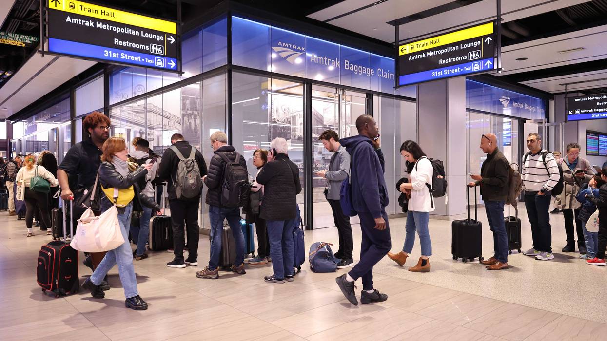 People wait to be helped by Amtrak workers at Moynihan Train Hall on November 12, 2024 in New York City. Amtrak suspended service between New York City and New Haven, Connecticut before the evening rush hour due to a brush fire in the Bronx that cut off power to trains.