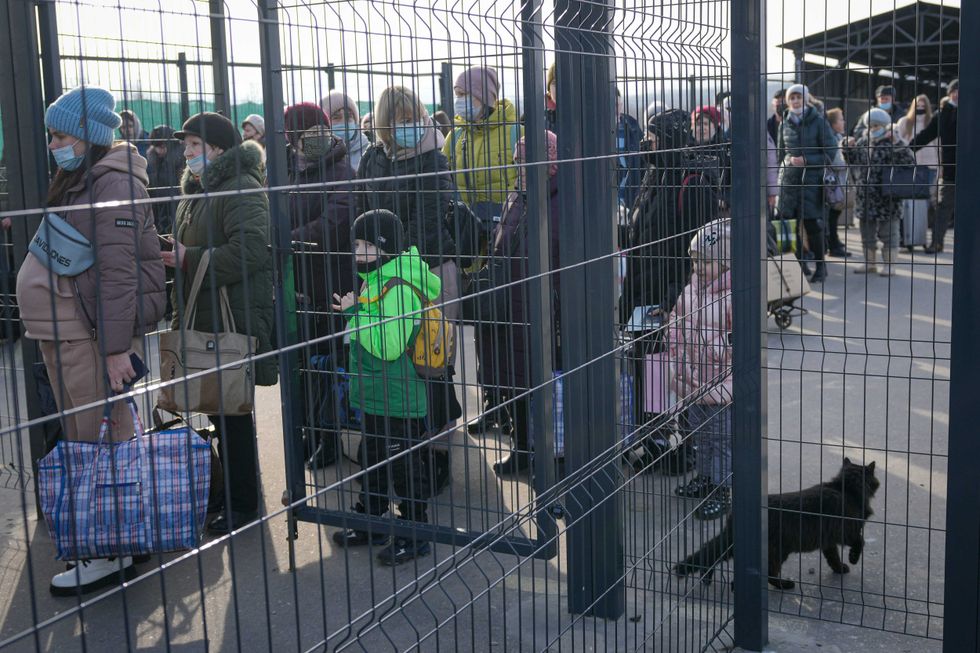 People wait to cross from pro-Russian separatists