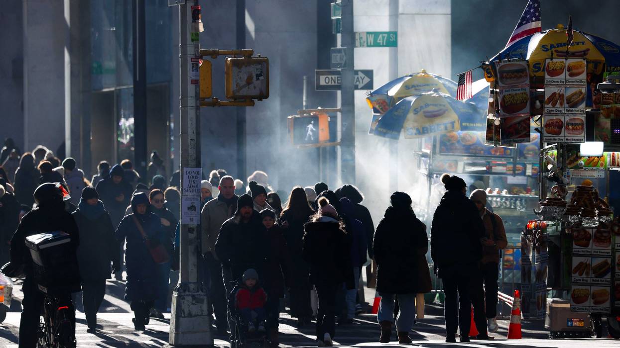 People walk along Sixth Avenue on a cold Dec. 23, 2024