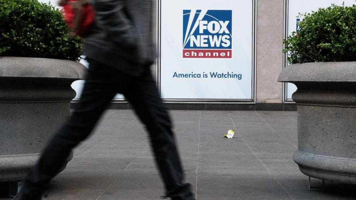 People walk by the News Corporation headquarters, home to Fox News, on April 18, 2023 in New York City.