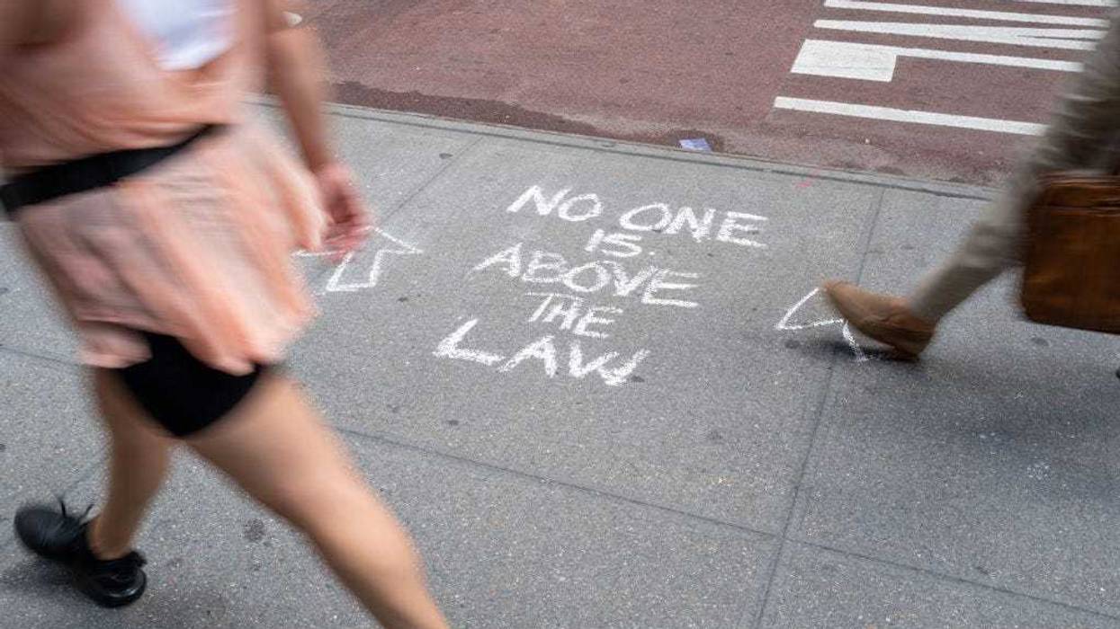 People walk by Trump Tower in Manhattan on August 10, 2022 in New York City. According to a recent report, the FBI was looking for nuclear-related documents aming other things when they searched Mar-a-Lago. (Photo by Spencer Platt/Getty Images)