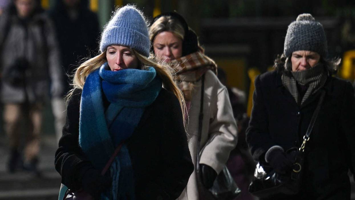 People walk in Midtown Manhattan during freezing cold temperatures on Jan. 8, 2025