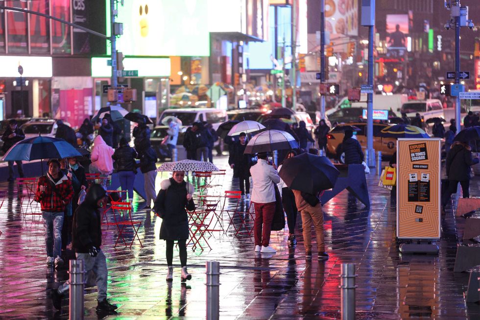 People walk in Times Square on Jan. 9, 2024