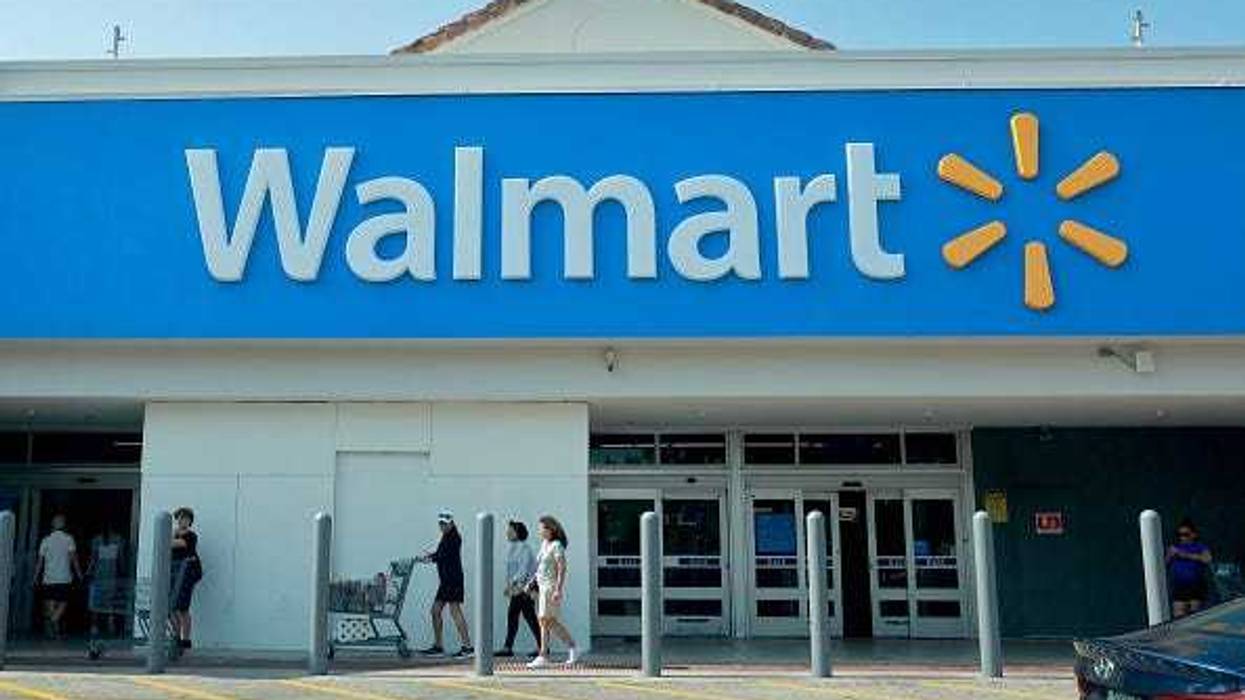 People walk near the entrance to a Walmart store on May 14, 2024 in Miami, Florida.