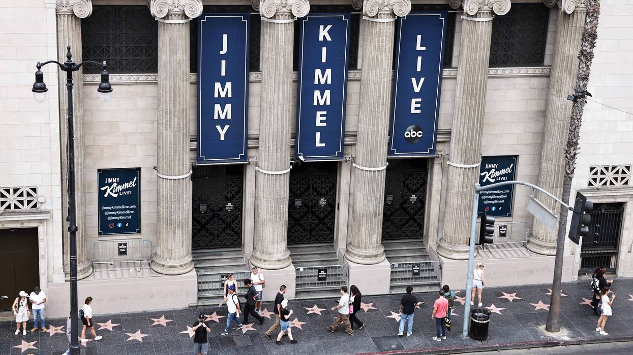 People walk outside the El Capitan Entertainment Centre where the "Jimmy Kimmel Live!" show is performed in Hollywood on September 18, 2025 in Los Angeles, California.