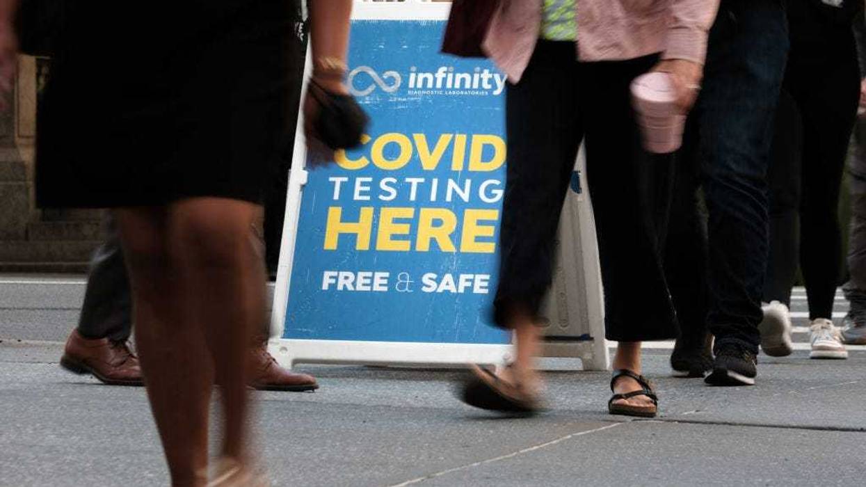 People walk past a Covid testing site on May 17, 2022 in New York City.
