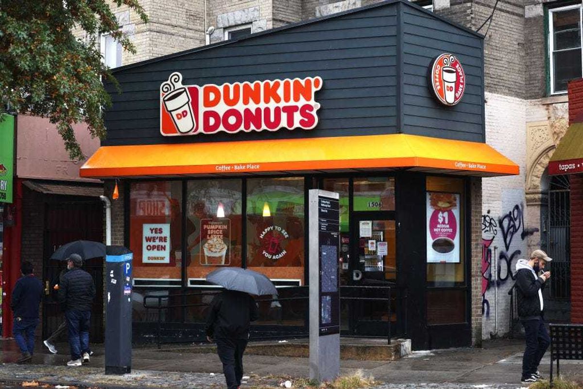 People walk past a Dunkin' store on October 26, 2020 in New York City.