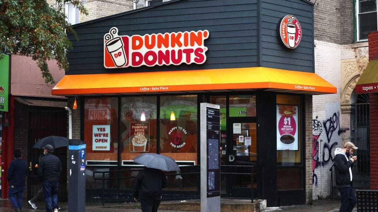People walk past a Dunkin' store on October 26, 2020 in New York City.