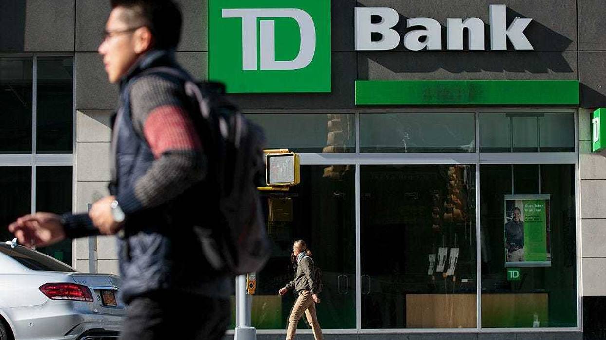 People walk past a TD Bank, October 24, 2016 in the Brooklyn borough of New York City.