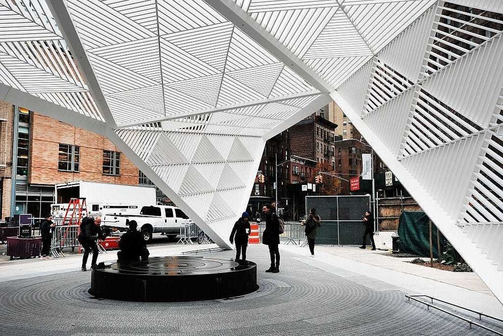 People walk through a new memorial to honor victims of the AIDS epidemic which was dedicated on World AIDS Day on December 1, 2016 in New York City.