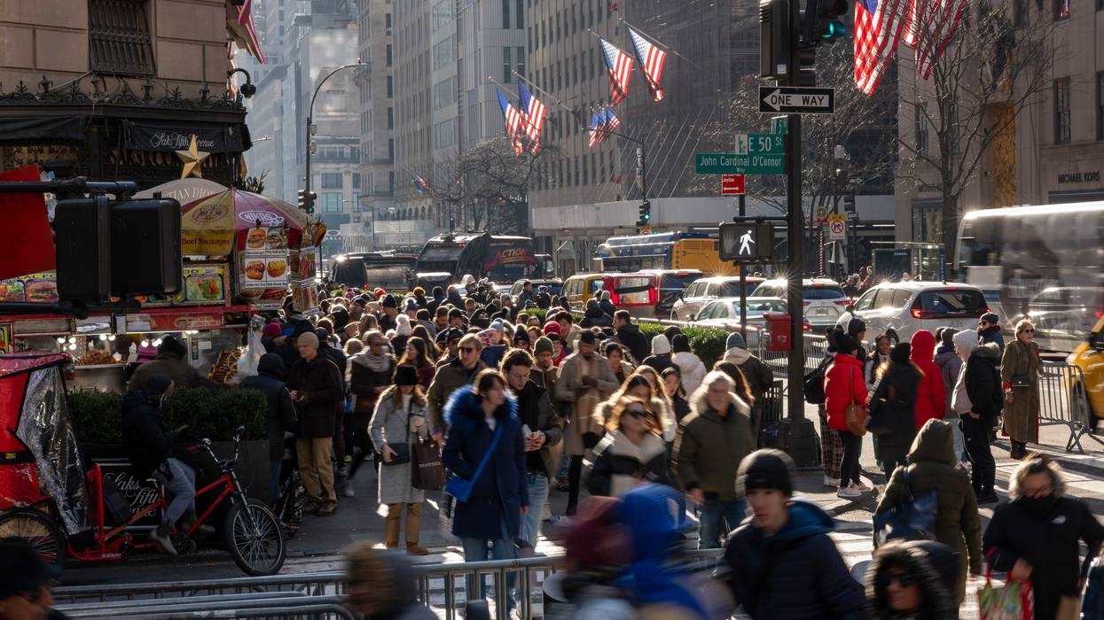 People walk through midtown Manhattan only days before the Christmas holiday on Dec. 22, 2023 in New York City.