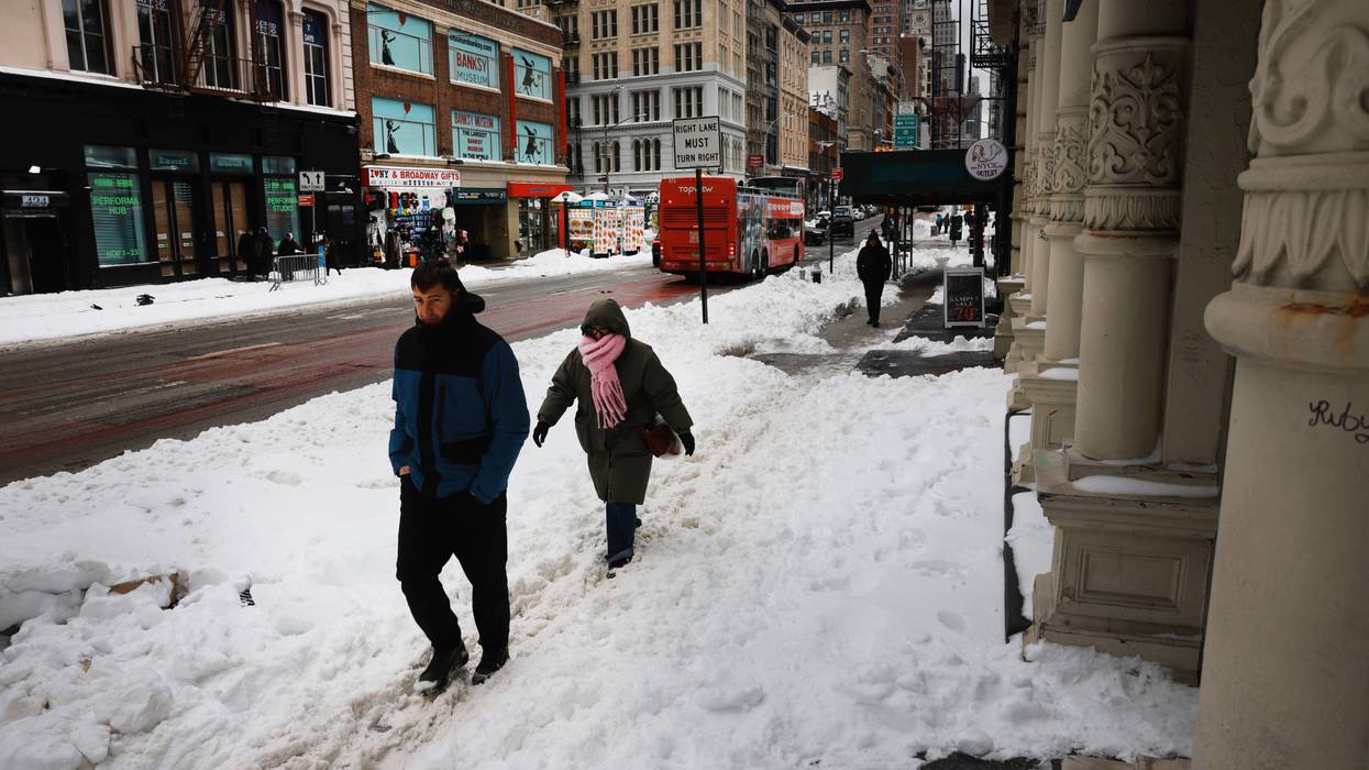 People walk through the snow in Manhattan on Monday amid brutally cold temperatures