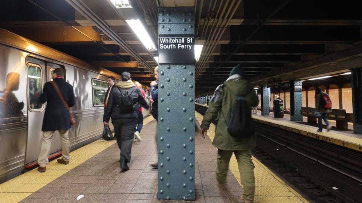 People walk through the Whitehall Street-South Ferry subway station on Dec. 3, 2019 in New York City.