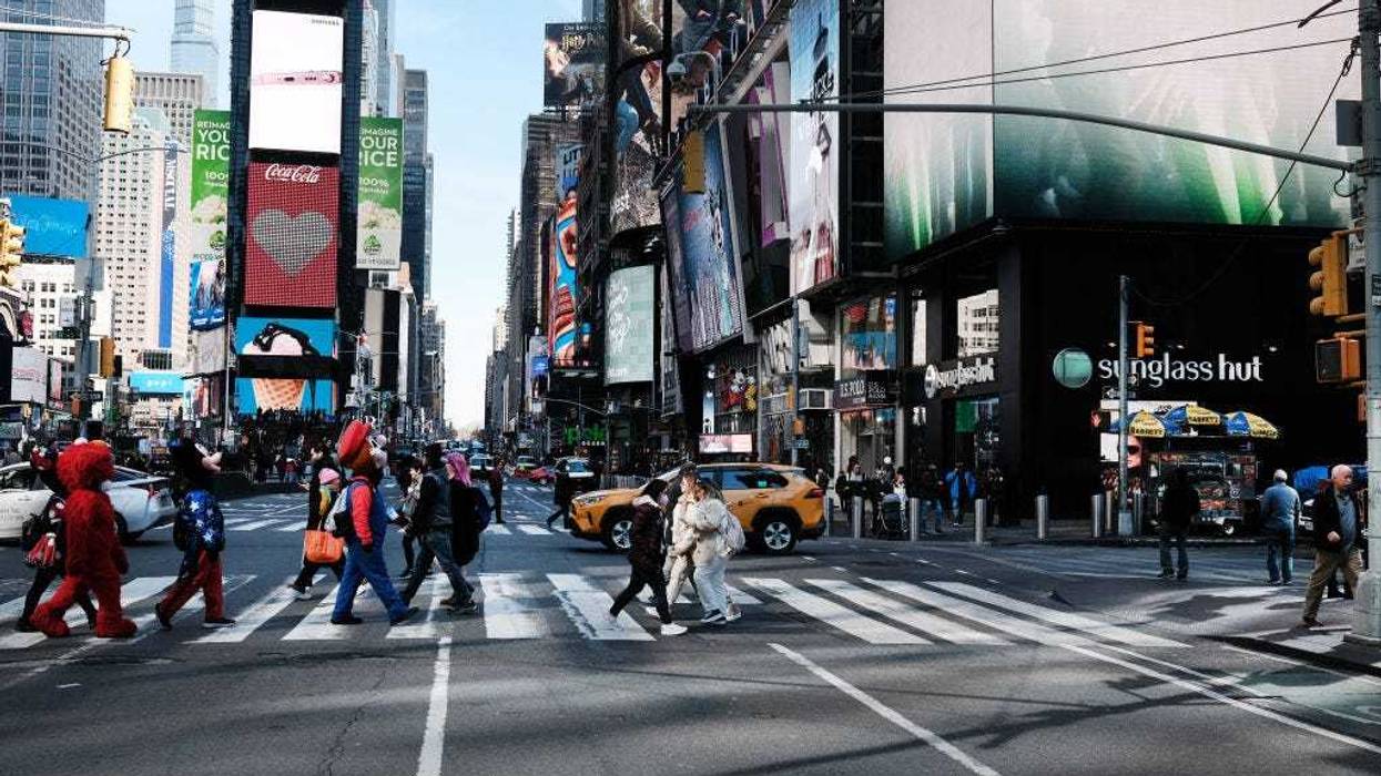 People walk through Times Square on March 11, 2022 in New York City. On the second anniversary of the pandemic.