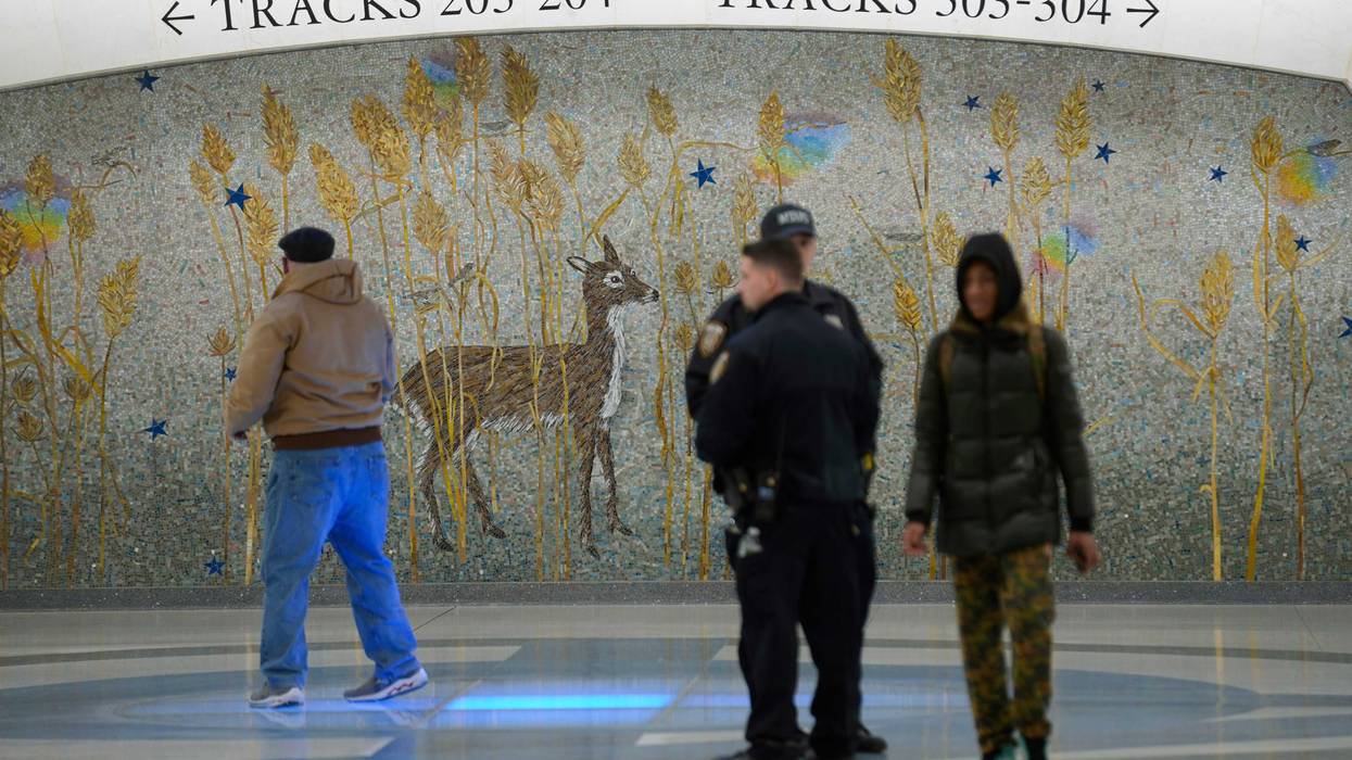 People walks past a mural in the new annex in Grand Central Station in New York, Wednesday, Jan. 25, 2023. (AP Photo/Seth Wenig)