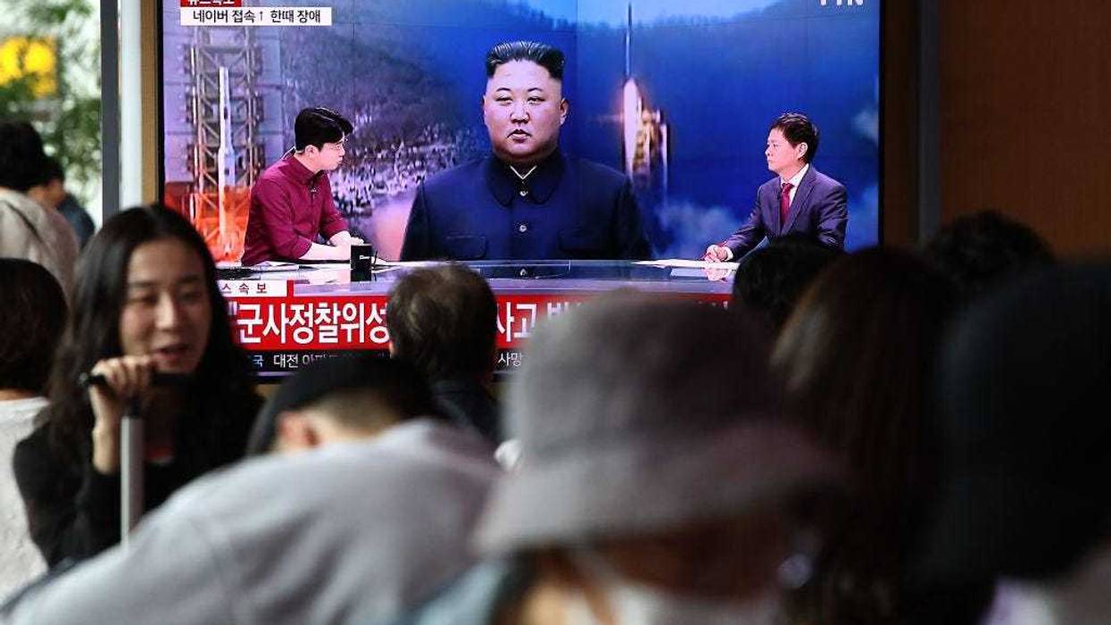 People watch a television broadcast showing a file image of a North Korean leader Kim Jong-Un at the Seoul Railway Station on May 31, 2023 in Seoul, South Korea.