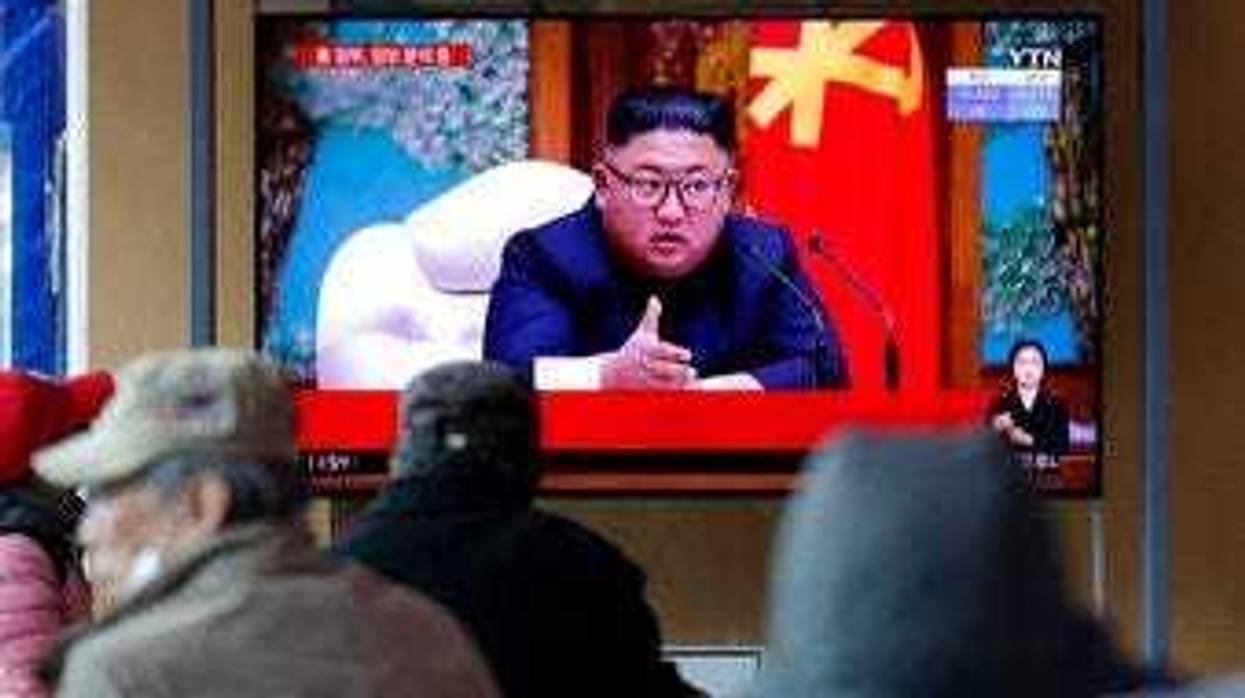 People watch a TV screen showing a news program reporting about North Korean leader Kim Jong Un with a file image at the Seoul Railway Station in Seoul, South Korea, Tuesday, April 21, 2020. (AP Photo/Lee Jin-man)