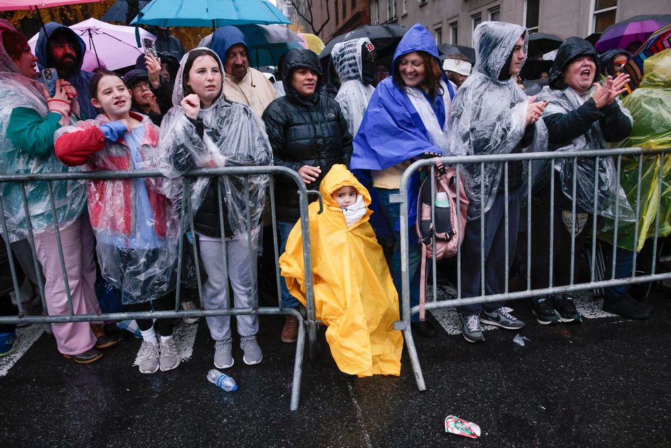 People watch the Annual Thanksgiving Day Parade on November 28, 2024 in New York City. This is the 98th Macy