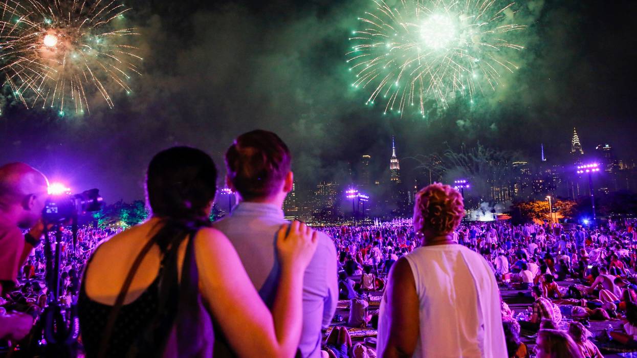 People watch the Macy's Fourth of July Fireworks from Hunter Point Park on July 4, 2018 in New York City