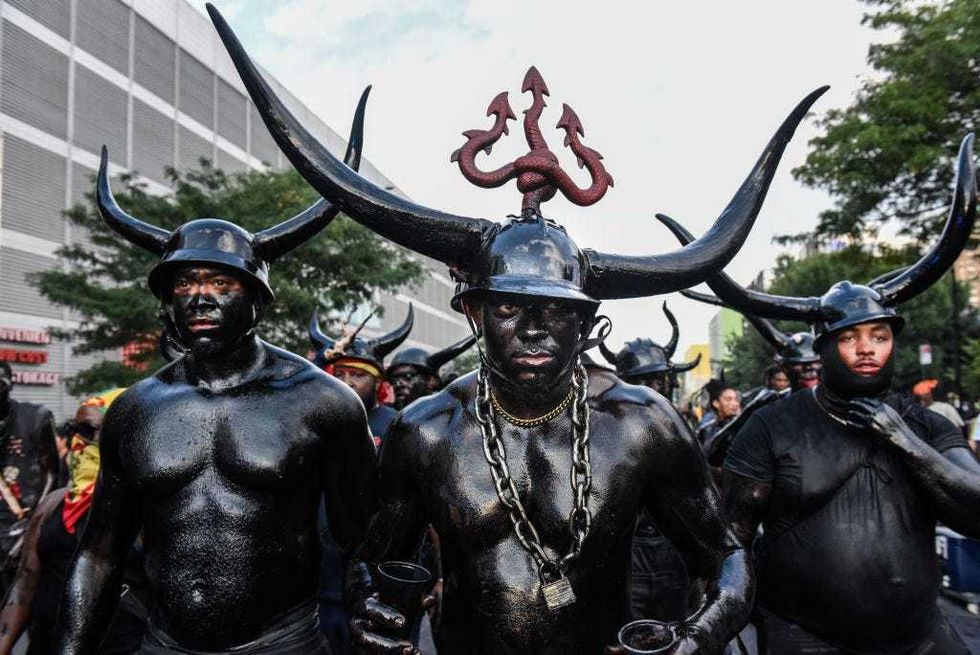 People wear horns to embody a character called "Jab Jab" (from the french for Devil) in a Caribbean street carnival starting at dawn called J