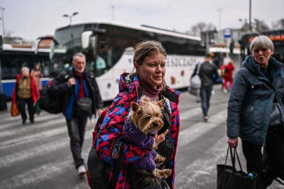 People who fled the war in Ukraine arrive from Przemysl by bus on March 29, 2022 in Krakow, Poland. The Polish government has said it may spend €24 billion this year hosting refugees fleeing the war in Ukraine, and is seeking more support from the European Union. With more than 2.2 million Ukrainian refugees, Poland is now the country with the second-largest foreign refugee population after Turkey.